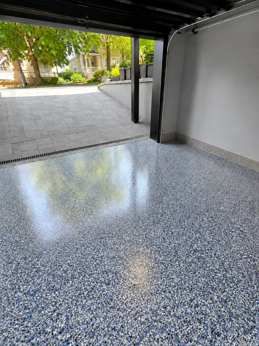 The same garage after: glossy grey and blue flake floor